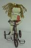 Doll on Tricycle